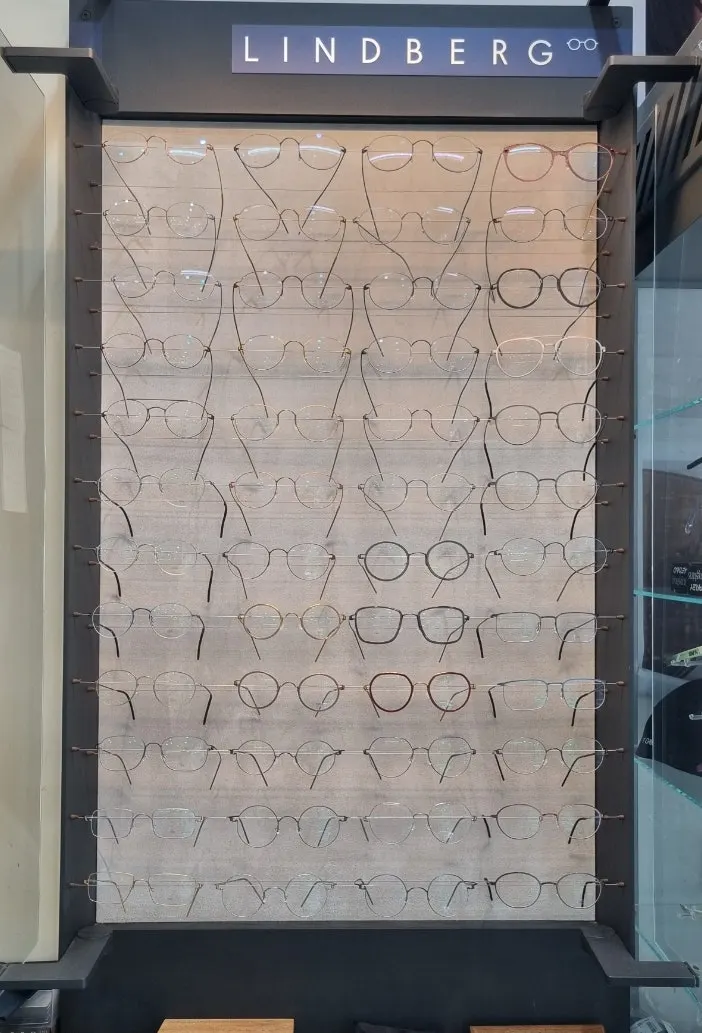 Display case with frames organized by brand