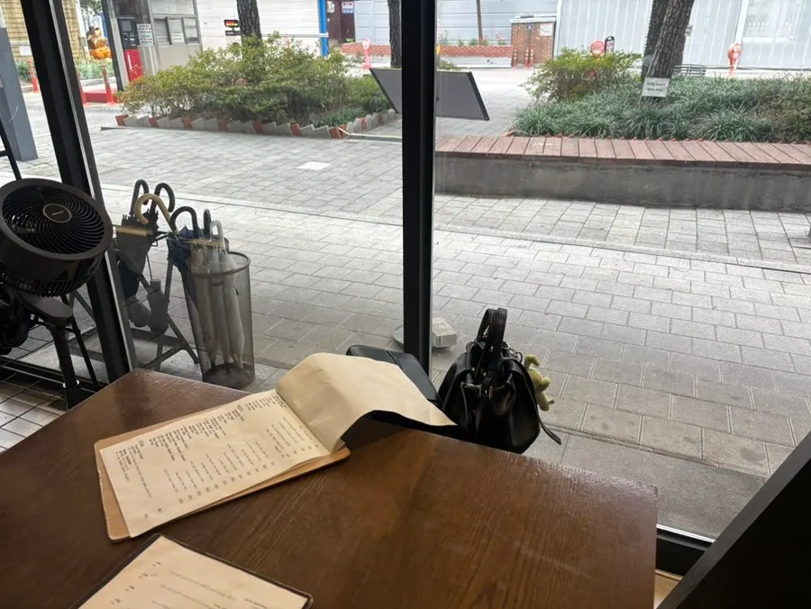 View of Sedici with two-top tables in the restaurant