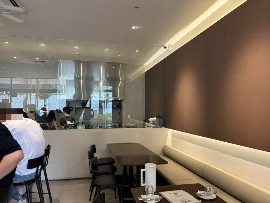 Sedici's open kitchen where cooking is visible