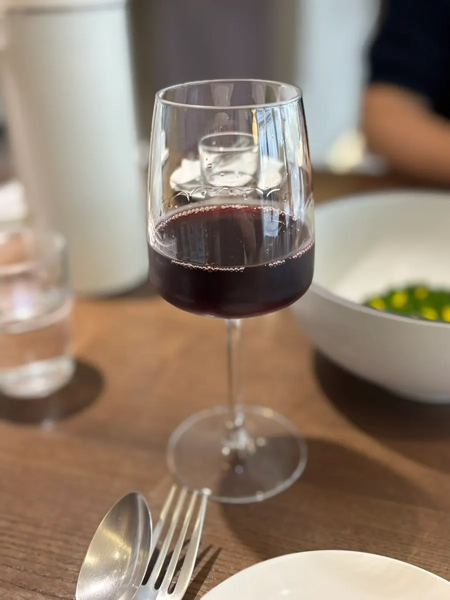 A glass of wine ordered at Sedici
