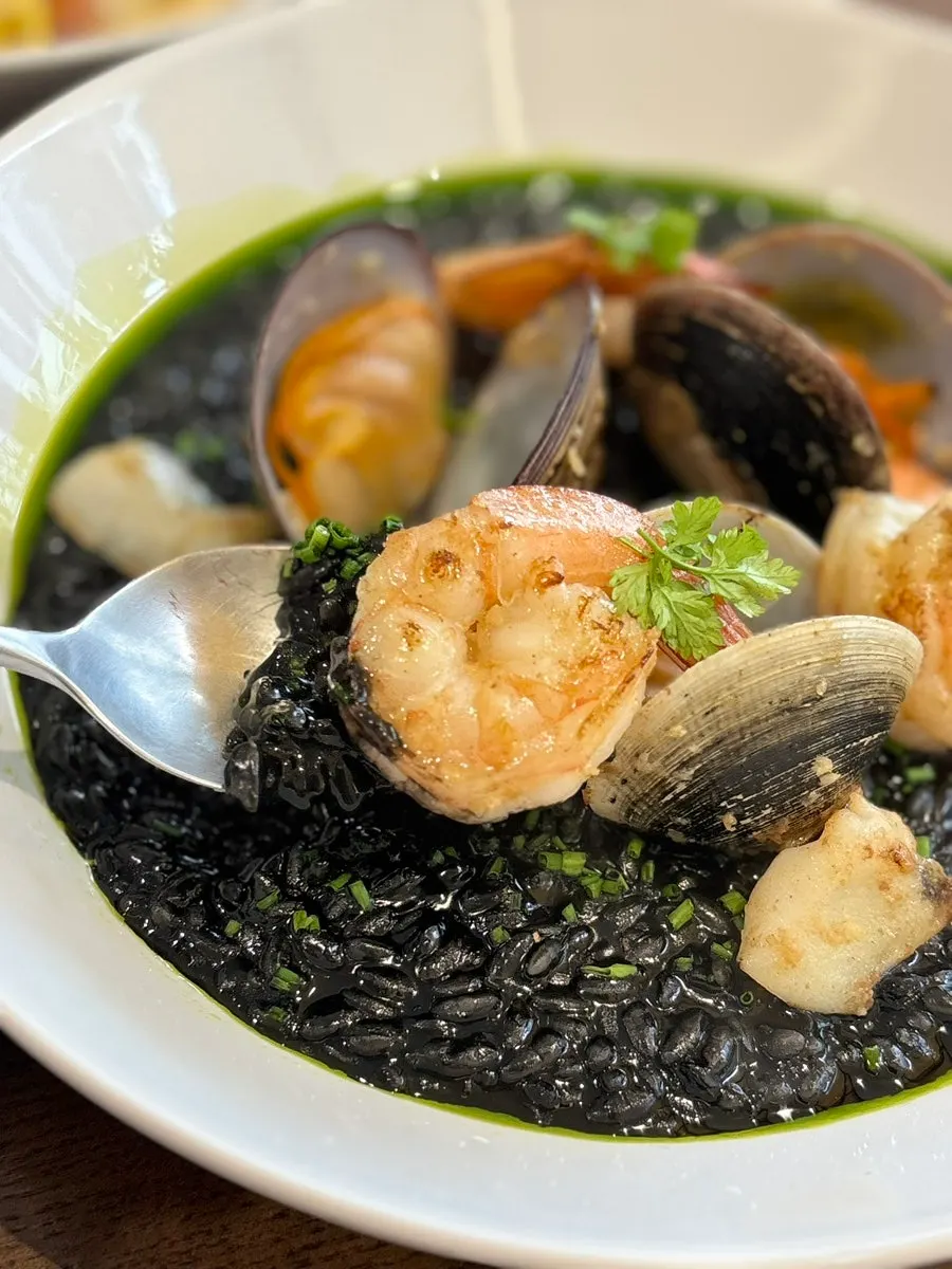 A spoonful of squid ink risotto grains