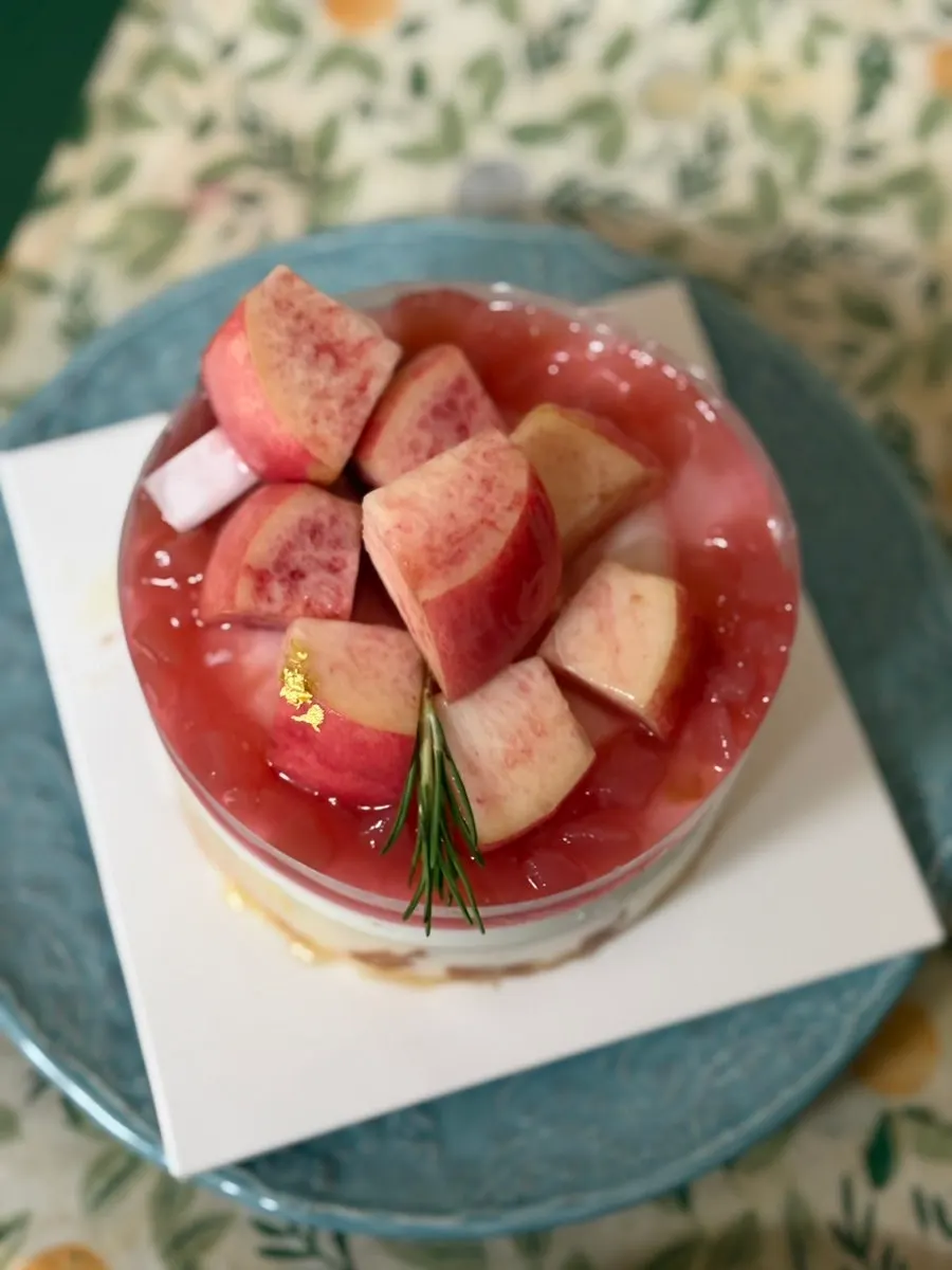 The peach cake unwrapped and placed on a plate