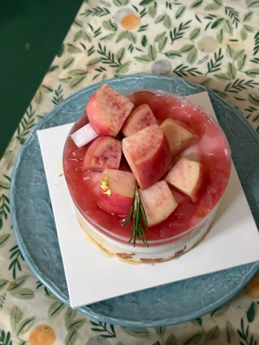 A slice of cake showing the cheese cream inside