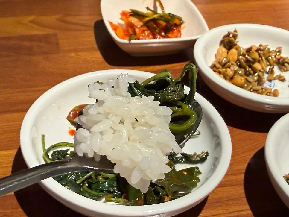Candied nuts and whole cabbage kimchi side dishes