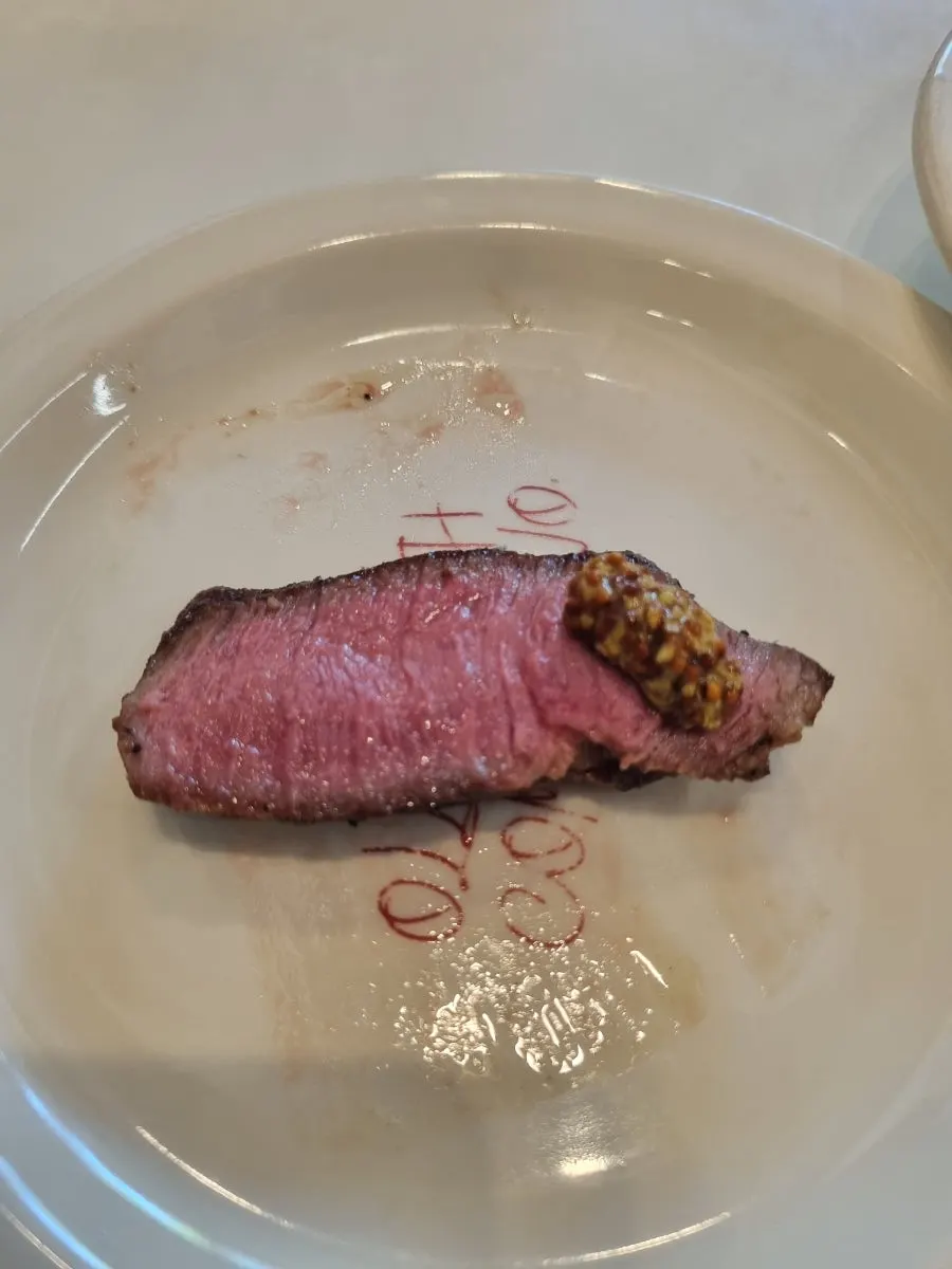 Flat iron steak with grilled mushrooms and vegetables