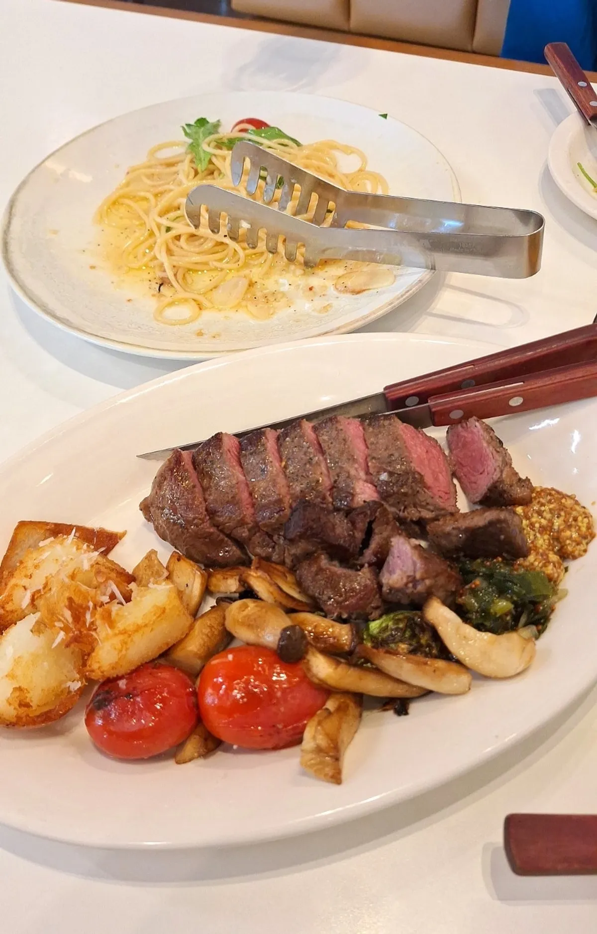 A plate of flat iron steak cooked medium