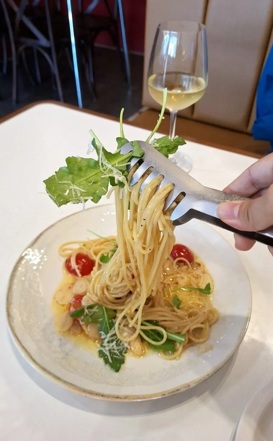 Aglio olio noodles lifted with a fork