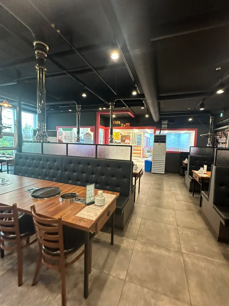 Seating area with many tables inside the restaurant