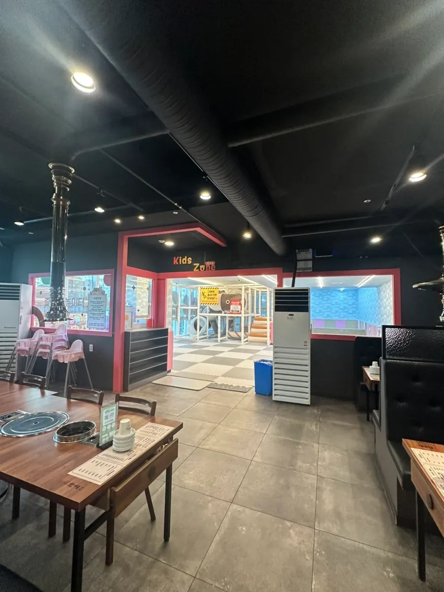 Seating and walkway inside the BBQ restaurant