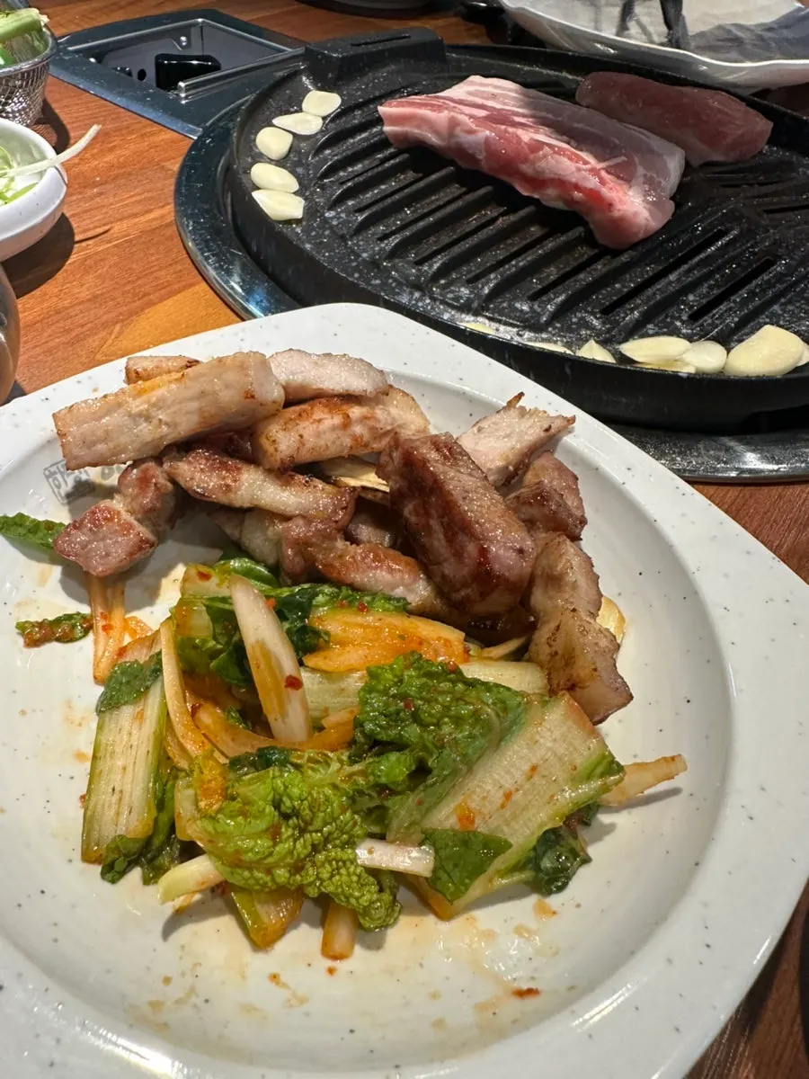 Grilled pork placed on a lettuce wrap