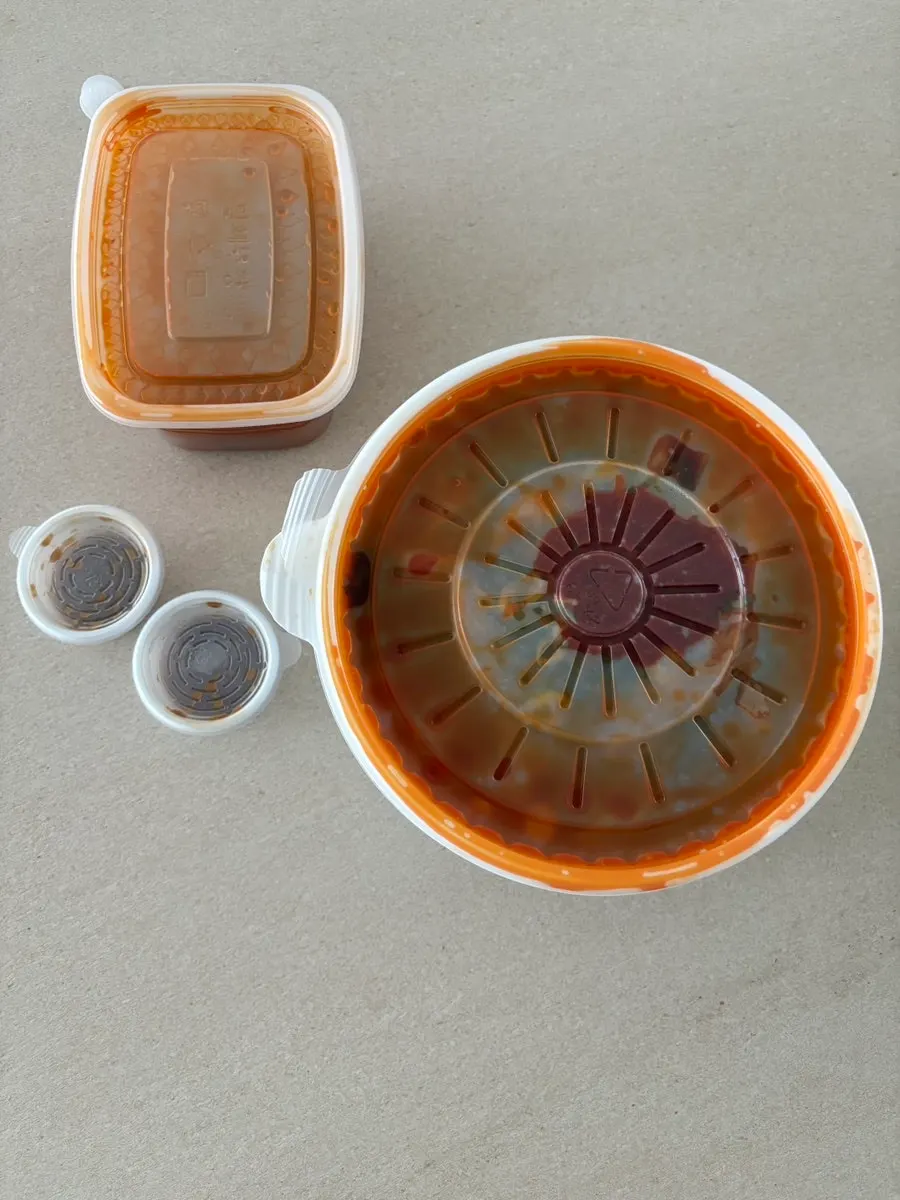 Three takeout containers of pork bone soup