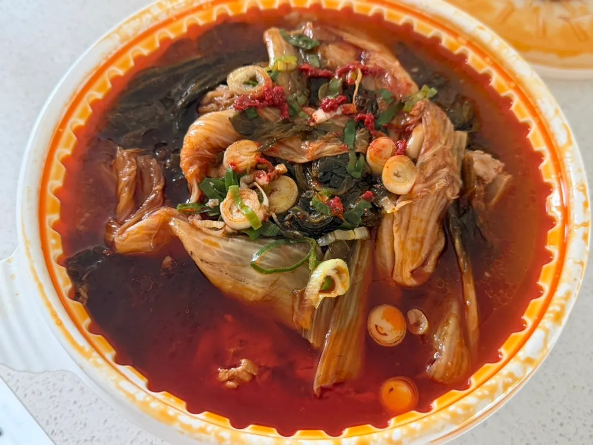 Pork bone soup takeout contents with bones and napa cabbage