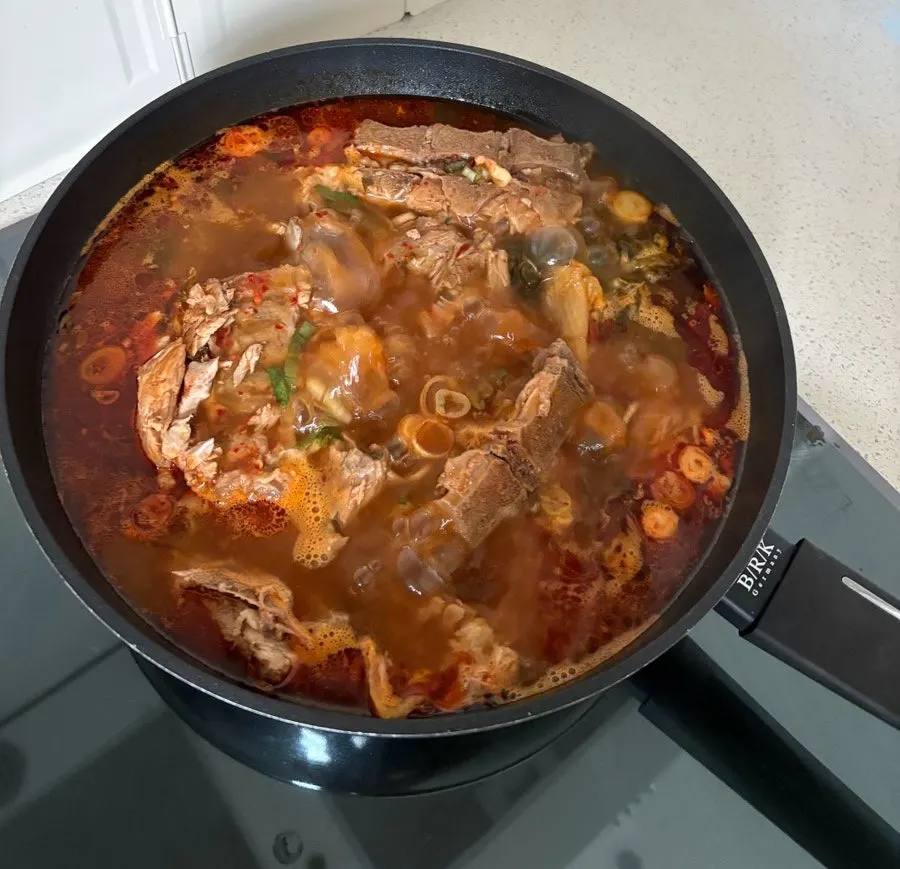 Pork bone soup showing meat attached to the bones