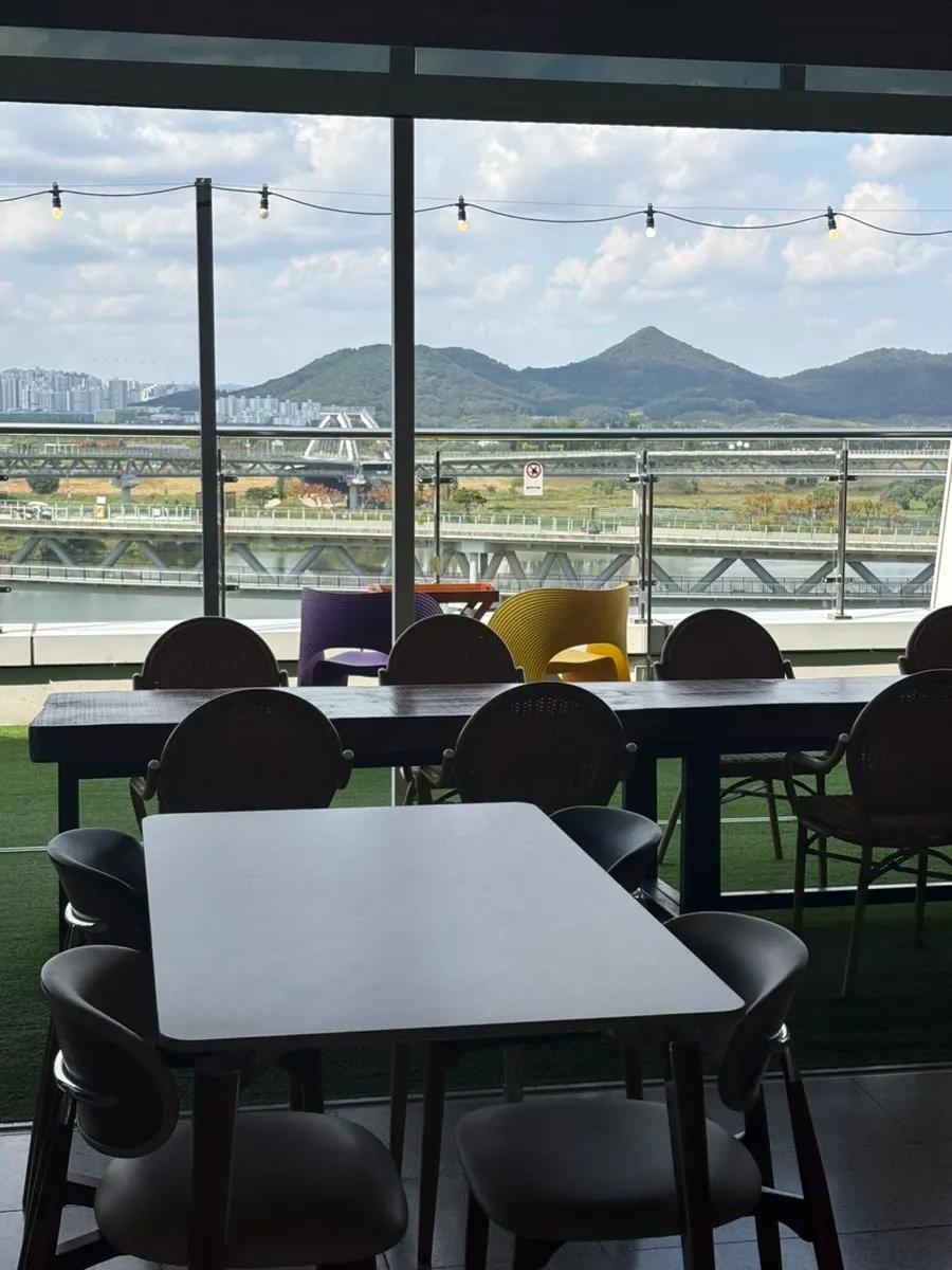 Window seats at Apere overlooking the Geumgang River