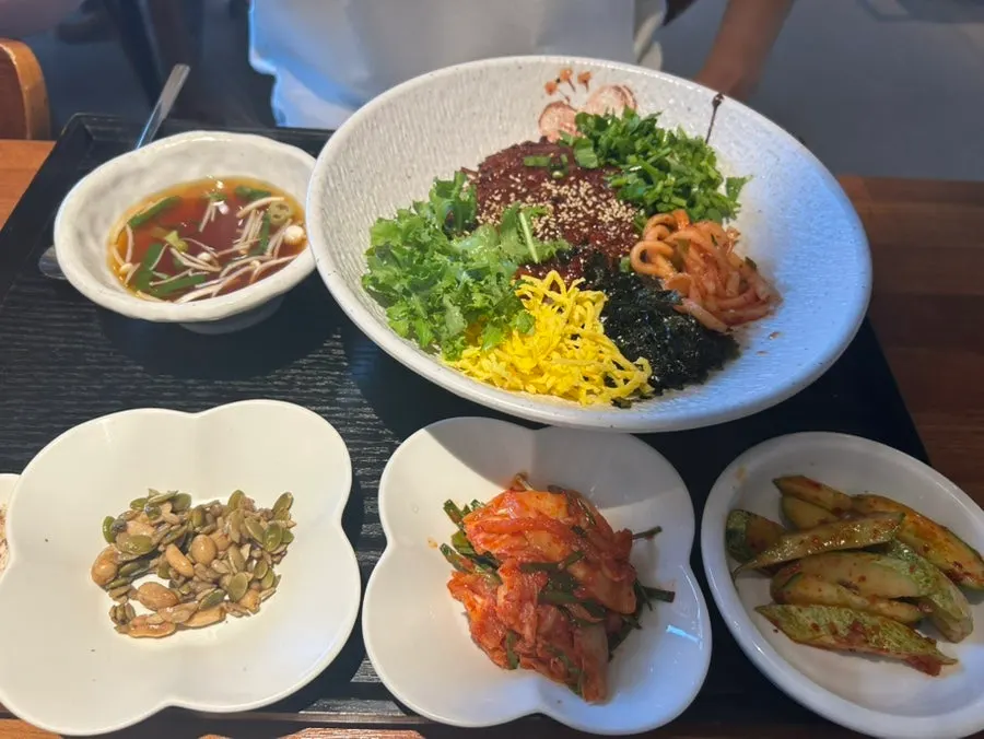 Rice bowl topped with plump shrimp and octopus