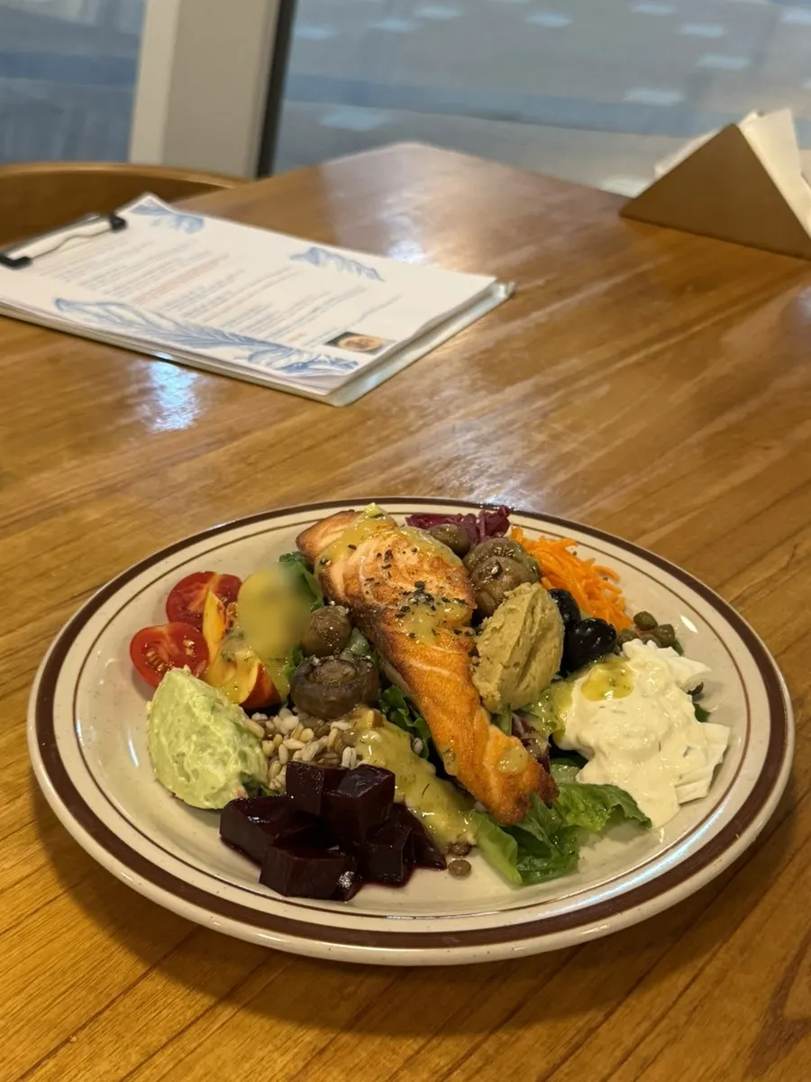 The salmon steak garden served on a wide plate