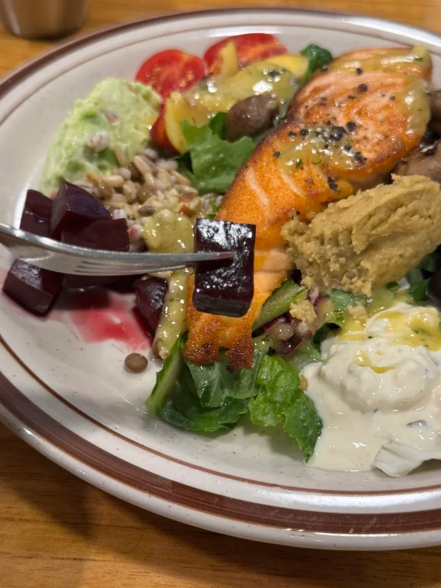 The salmon steak garden drizzled with special dressing