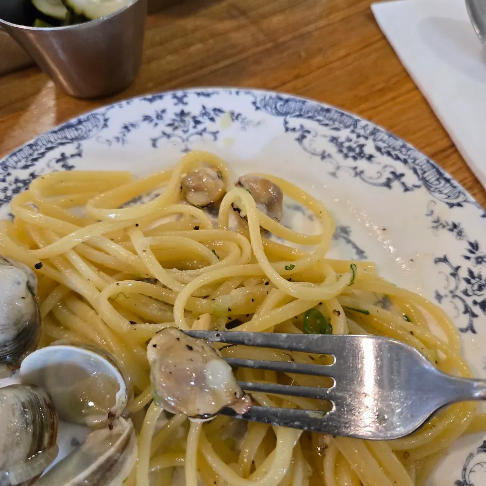 Noodles lifted up from the classic vongole pasta