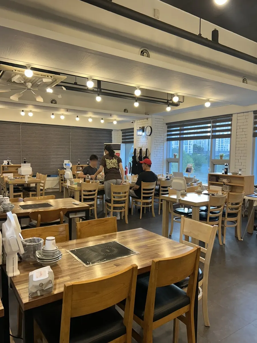 Spacious interior with tables arranged comfortably