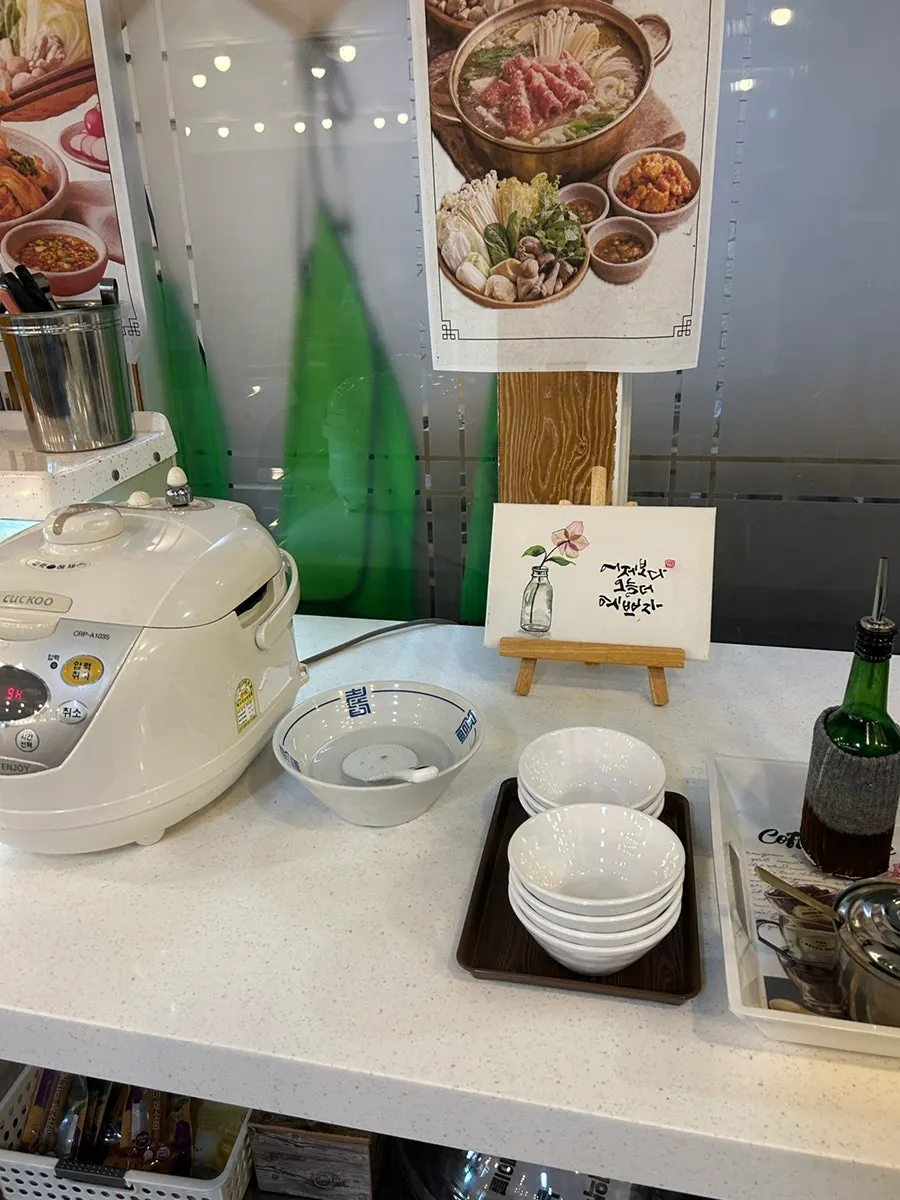 Self-serve bar with side dishes and extra noodles