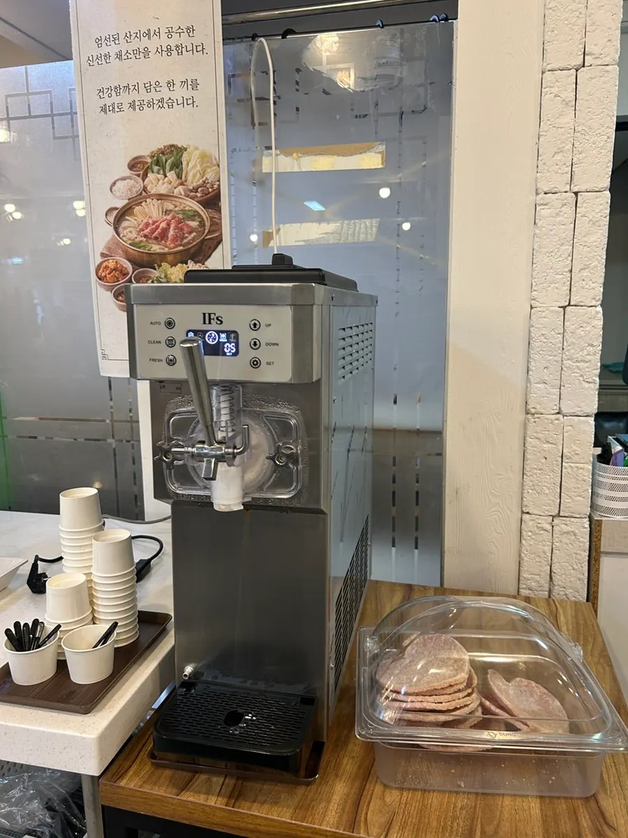 Self-serve bar corner with ramen noodles, kalguksu noodles, and rice