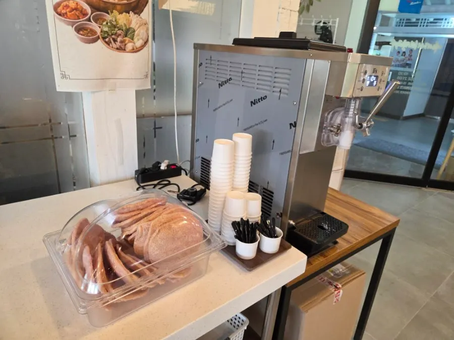 Self-serve broth and ramen noodle station
