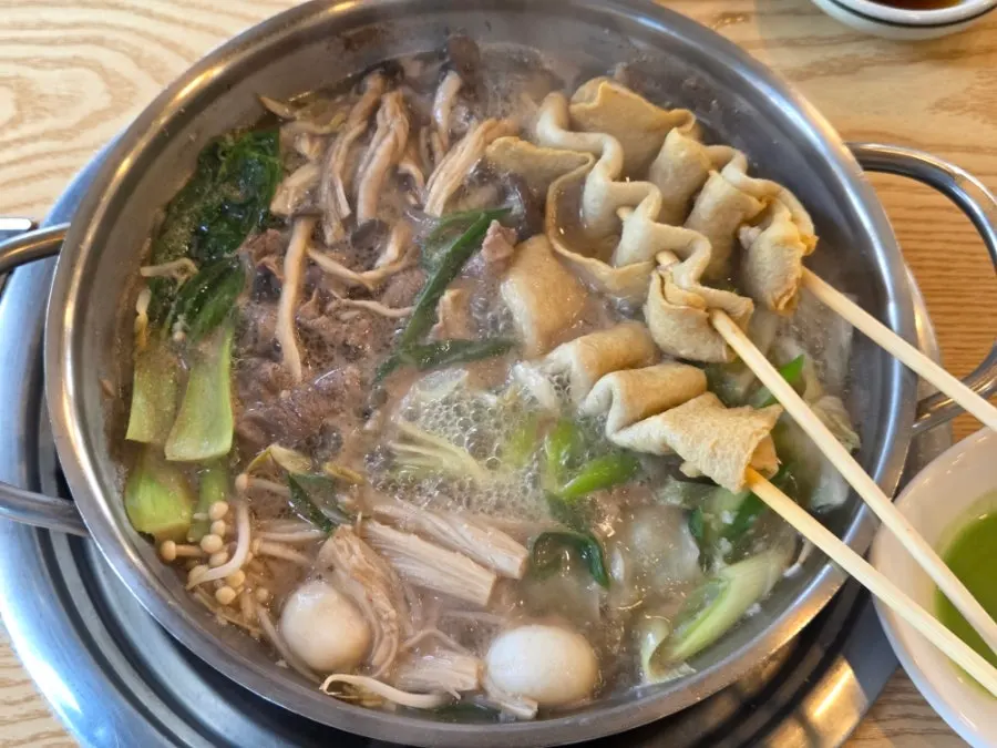Korean beef bone broth simmering for shabu-shabu