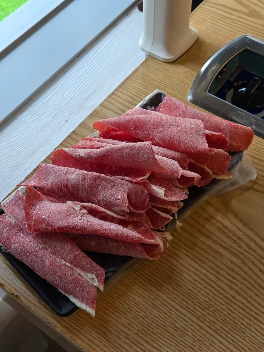 Beef chuck top cooking in the shabu-shabu broth