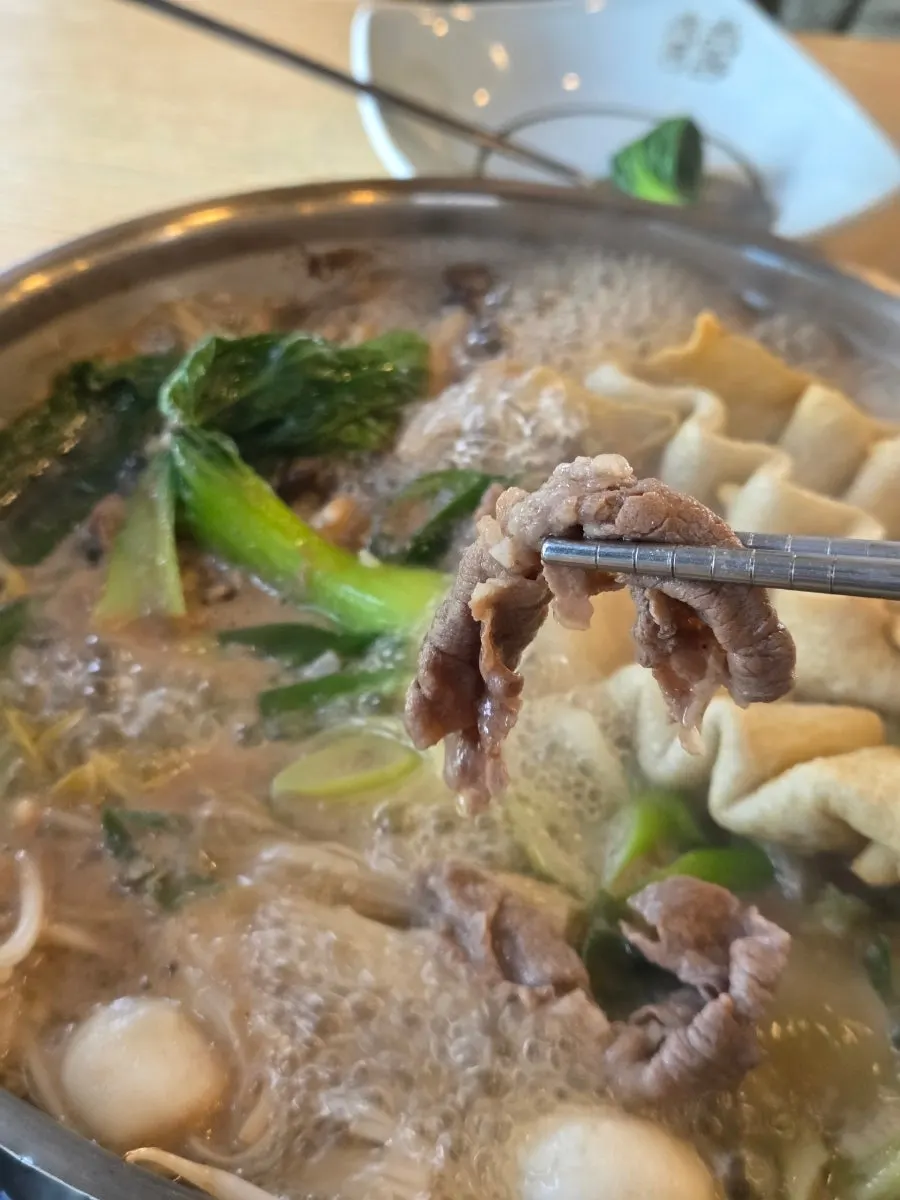 Shabu-shabu meat dipped in house soy sauce