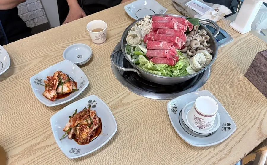 Wide table seating suitable for dining with a child