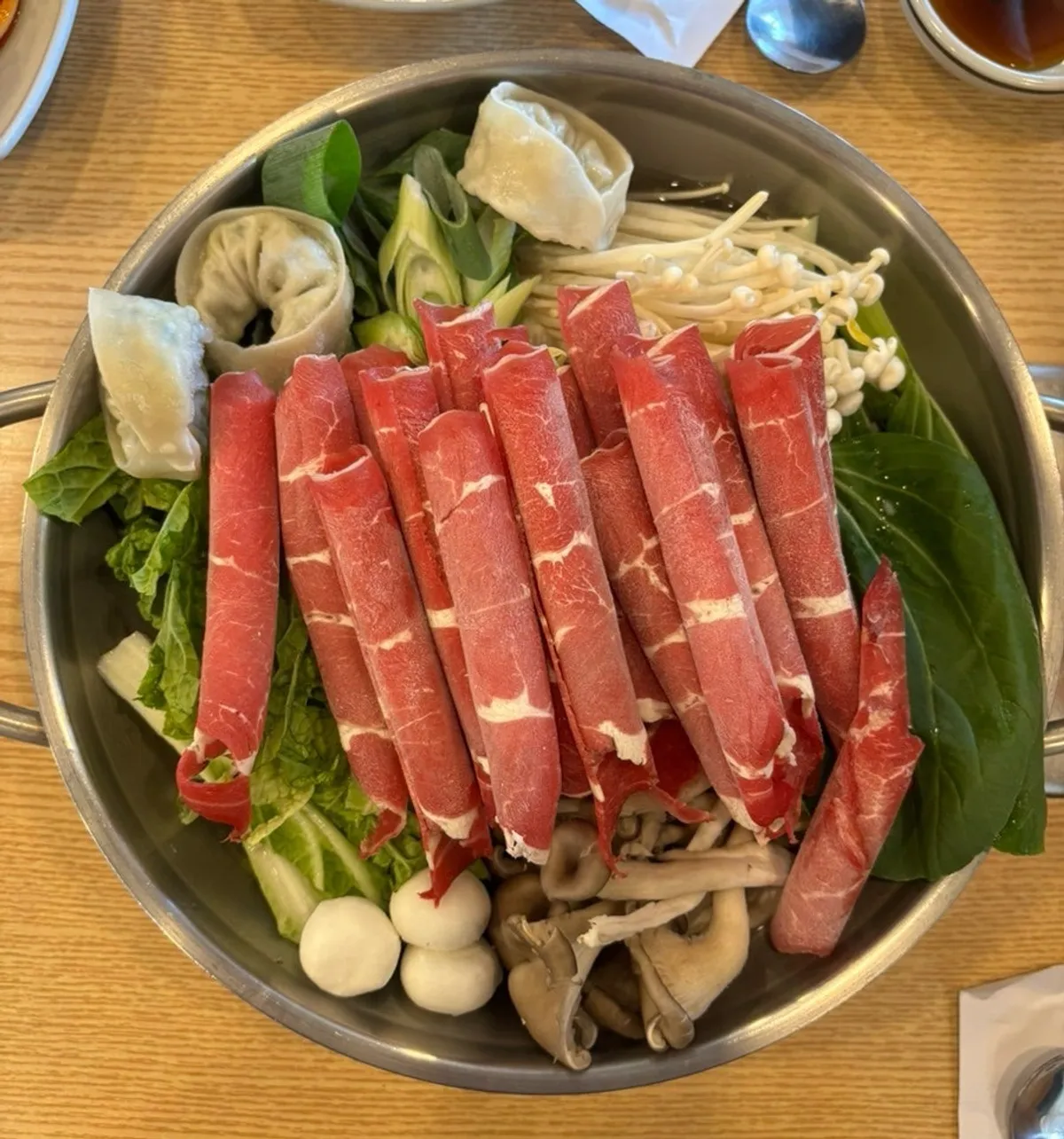 Free glass of makgeolli served with pajeon