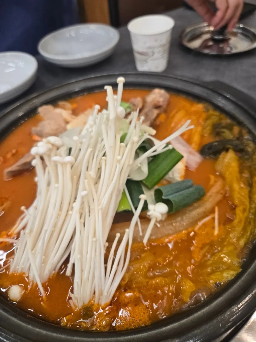 Meal being prepared on the table at Chung-sil Hoegwan