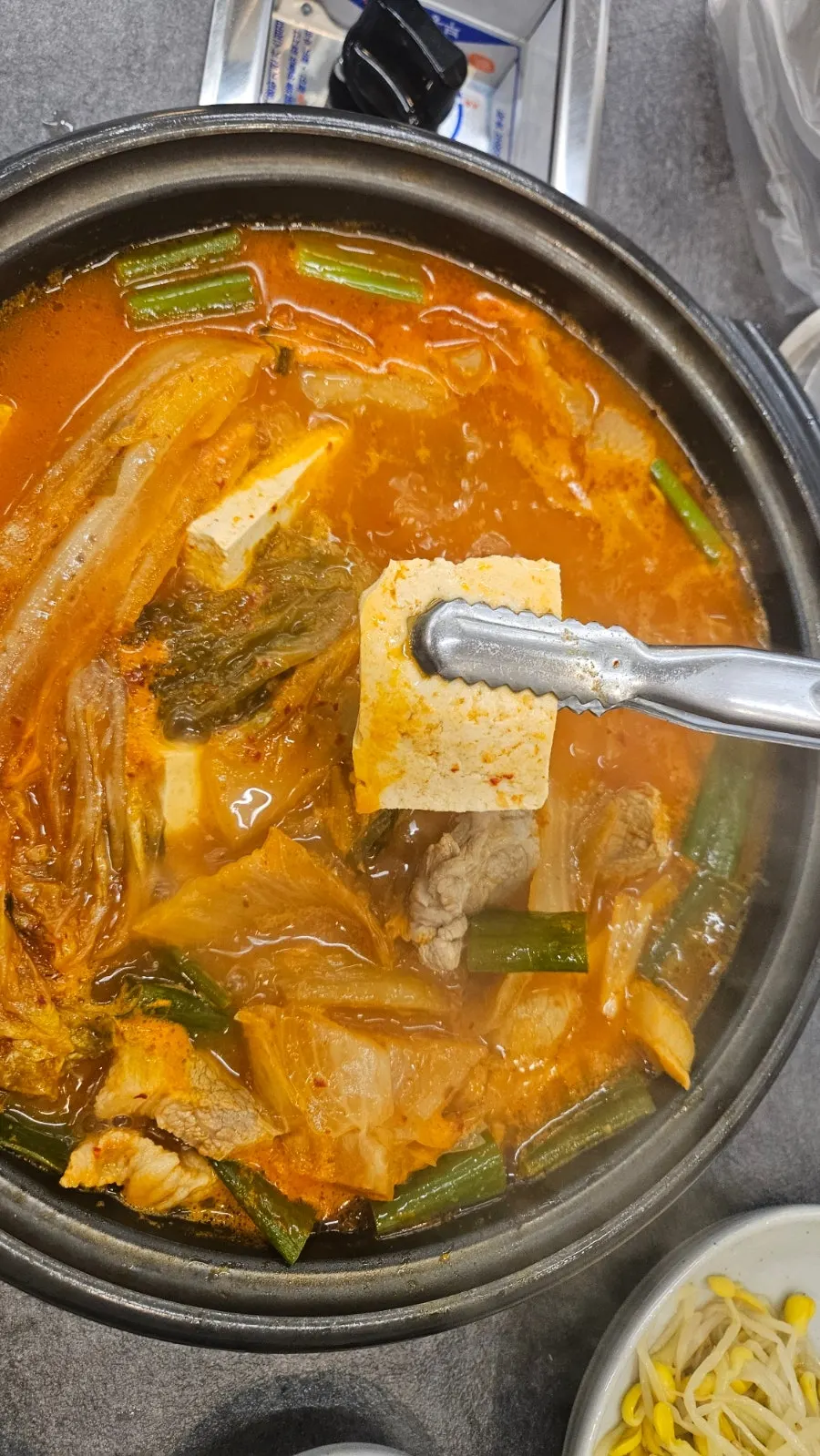 Spoonful of kimchi jjigae broth