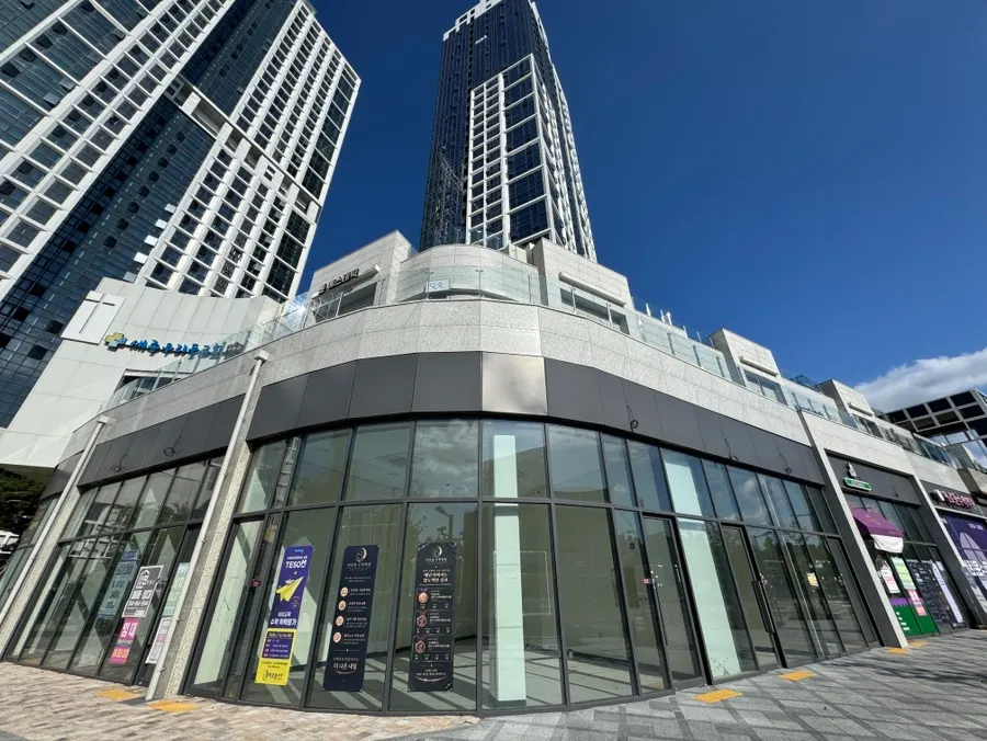 View of the Parc Blanc arcade across from Sejong Daeseong High School
