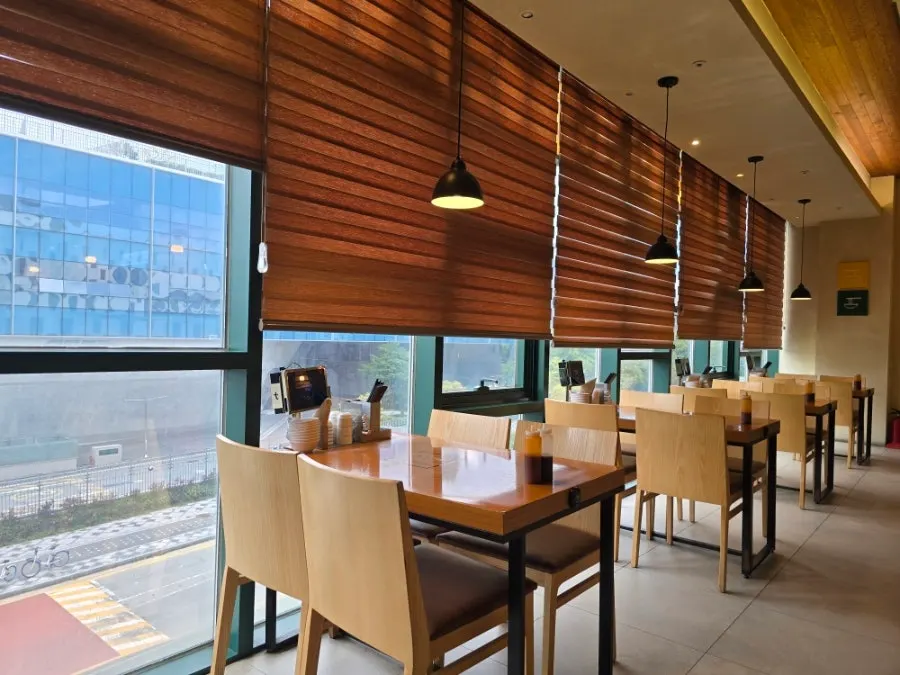 Restaurant tables arranged along the windows