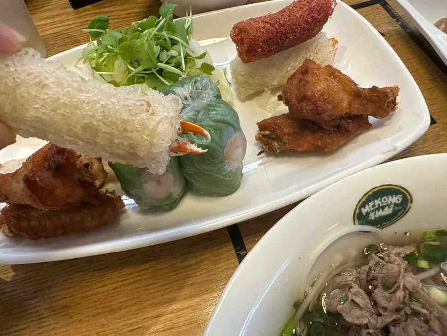 Vietnamese wraps eaten with a child