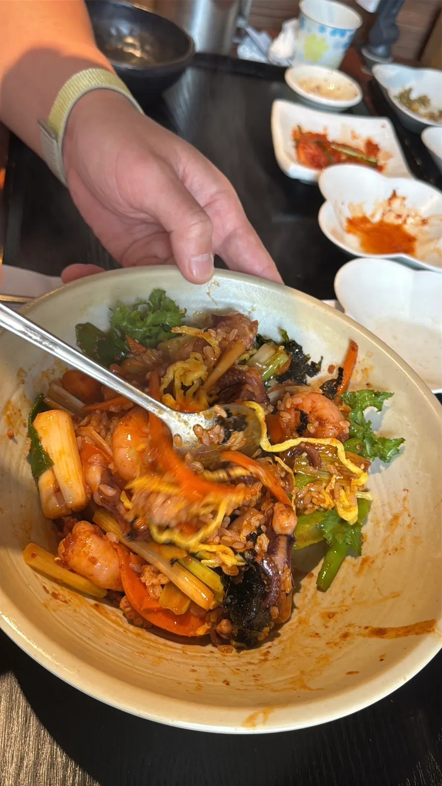 Close-up of the rice bowl topped with octopus and shrimp