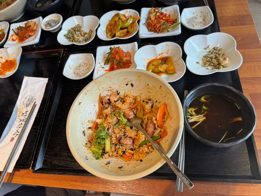 Family meal continuing at a table in Bapkkot Hansang