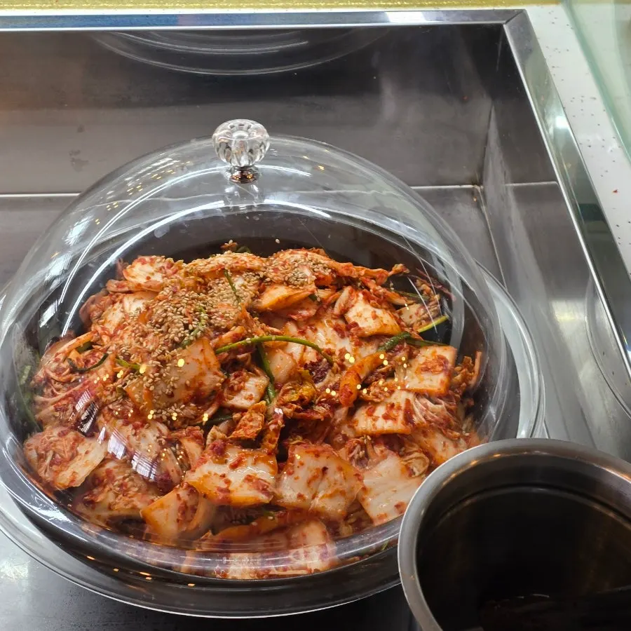 Tteokbokki and side dishes at the self-serve bar