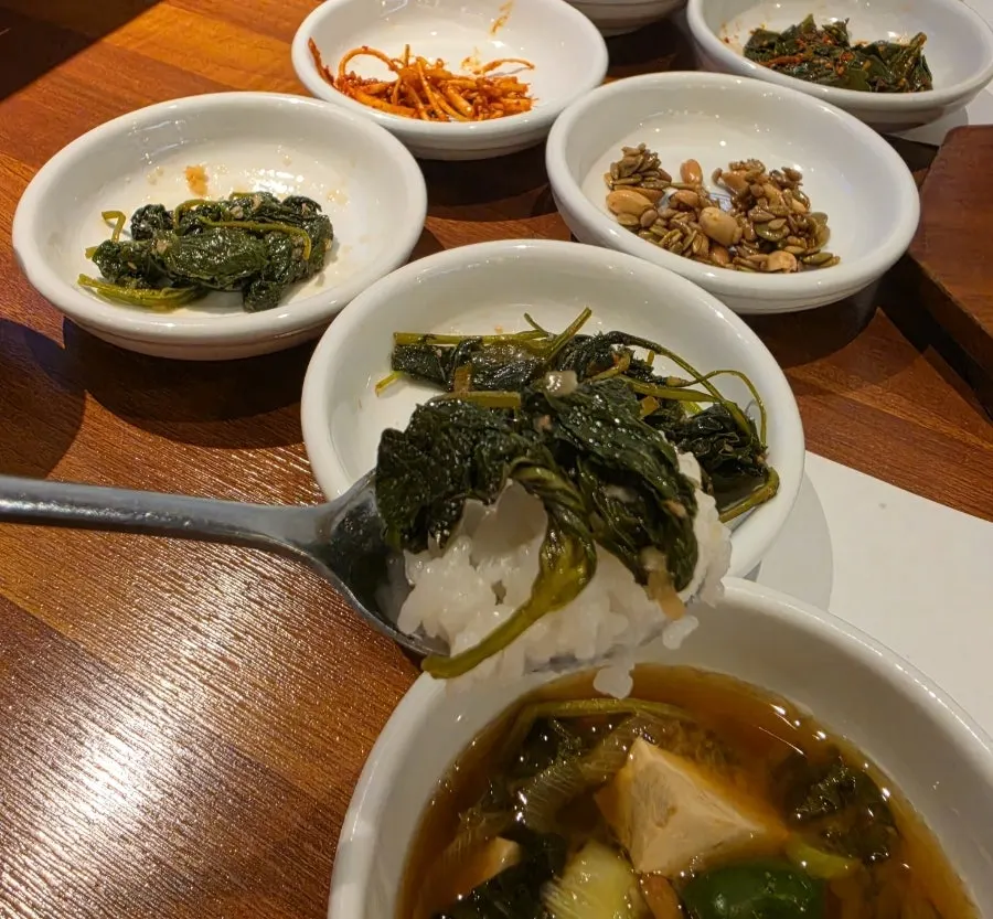 A spread of assorted namul vegetable side dishes
