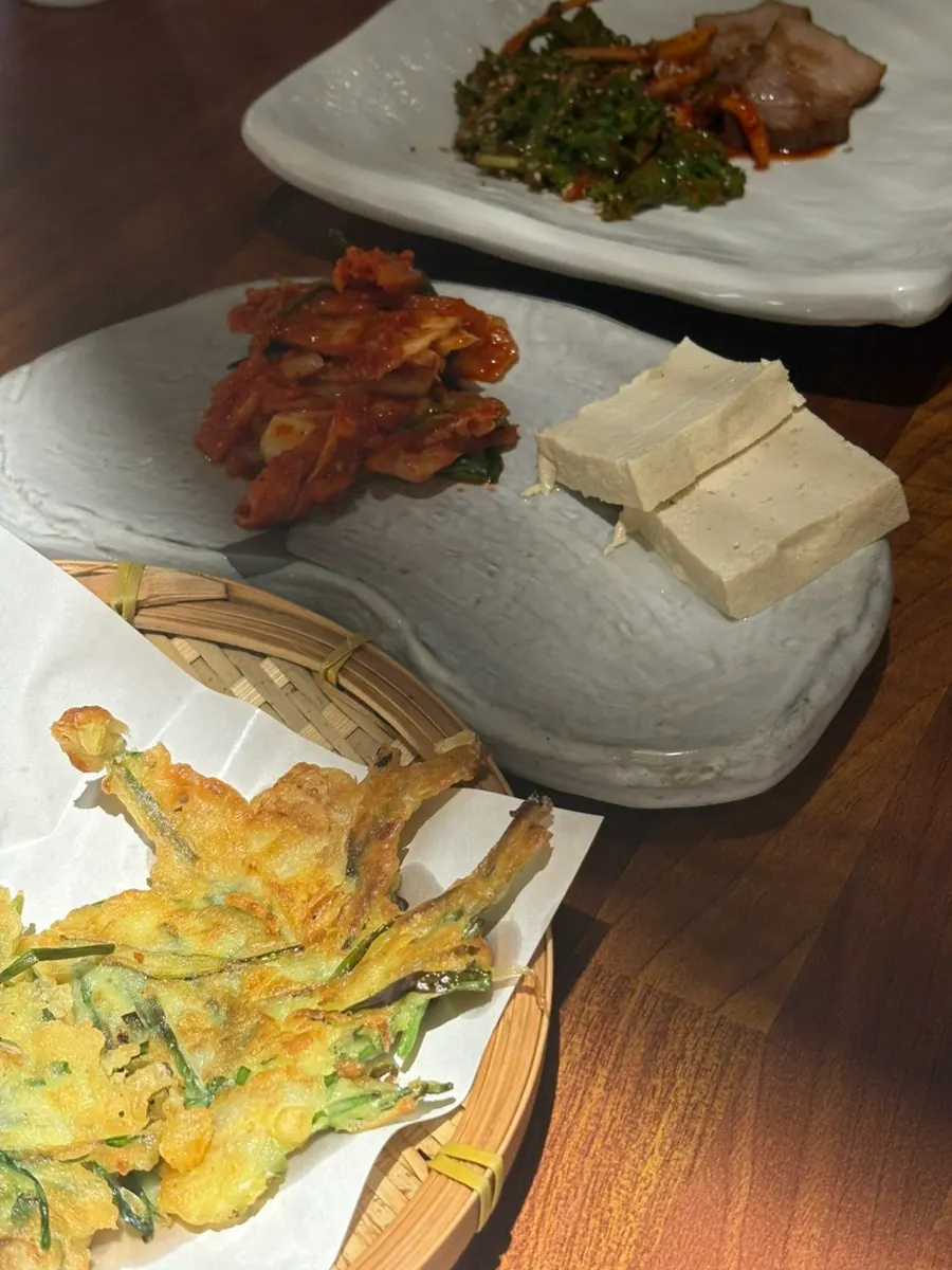 A bossam wrap topped with namul