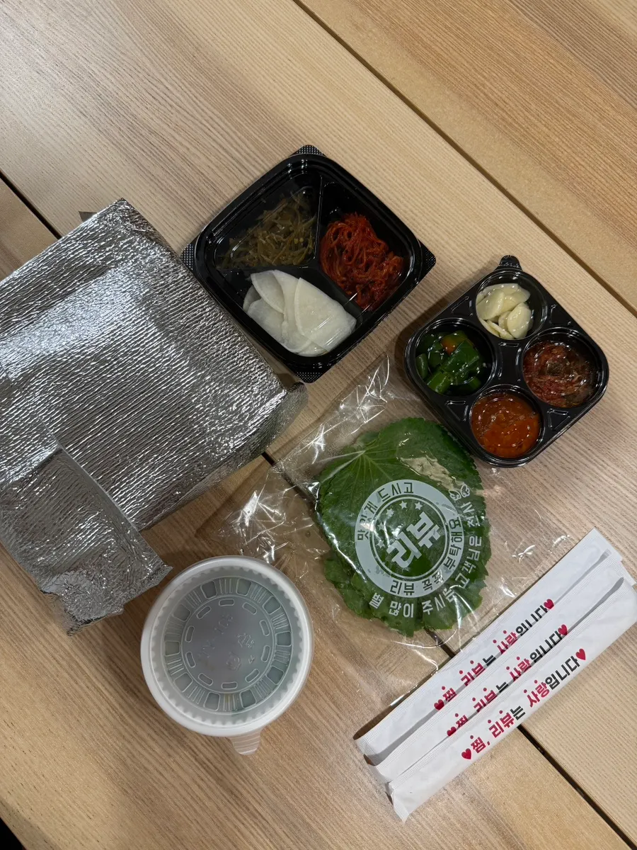 Takeout jokbal spread laid out at home