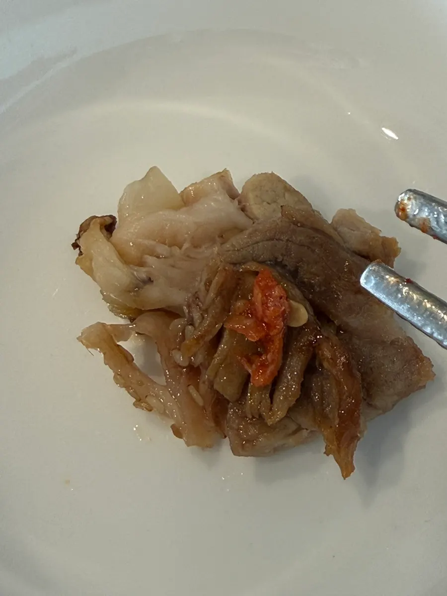 A piece of jokbal with both lean meat and skin attached