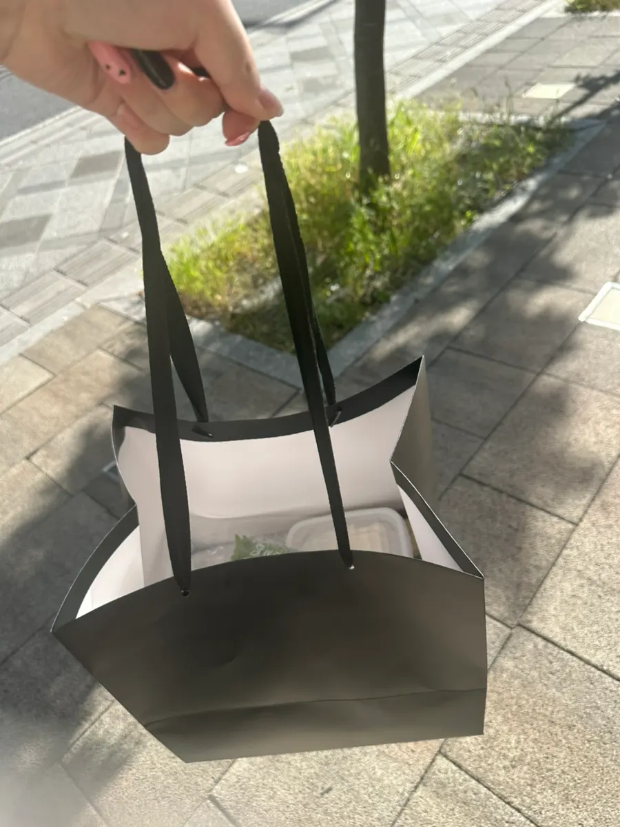 Tofu-kimchi bossam packed in a Cheongmigwan takeout shopping bag
