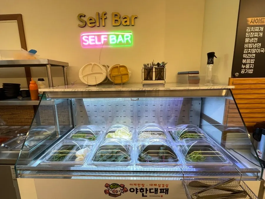 Wrap vegetables and other produce laid out at the self-serve bar