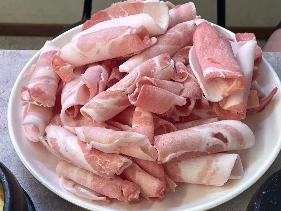 Plate of three servings of daepae samgyeopsal