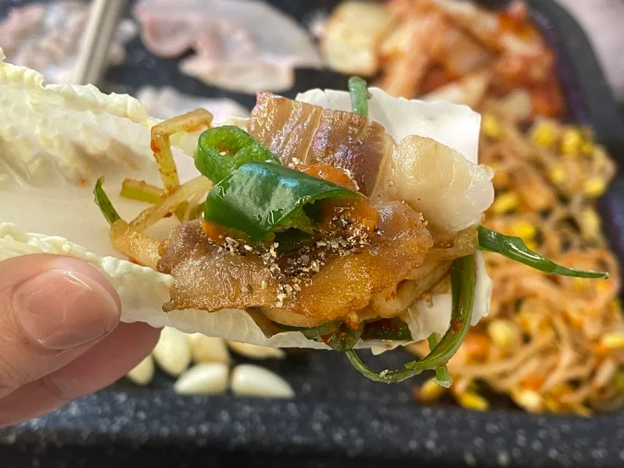 Full spread of daepae samgyeopsal and wrap vegetables at Yachae Hanssam Daepae
