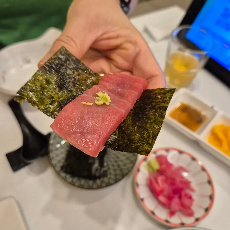 Sashimi wrapped with seaweed and sesame oil