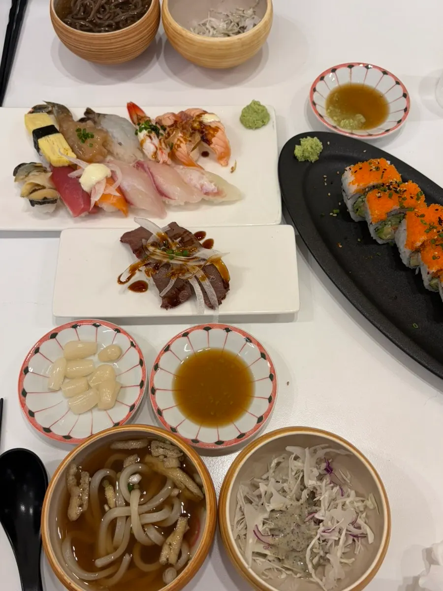 Wagyu sushi topped with onion and sauce