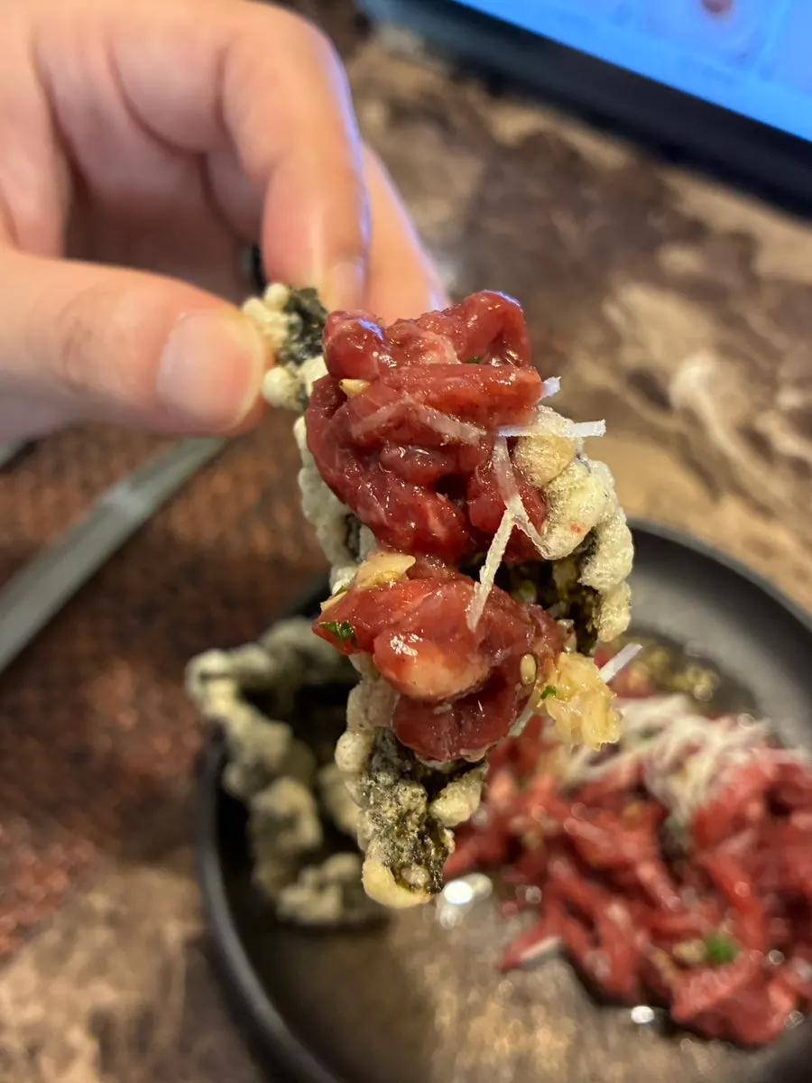 Truffle yukhoe served on top of gim-bugak
